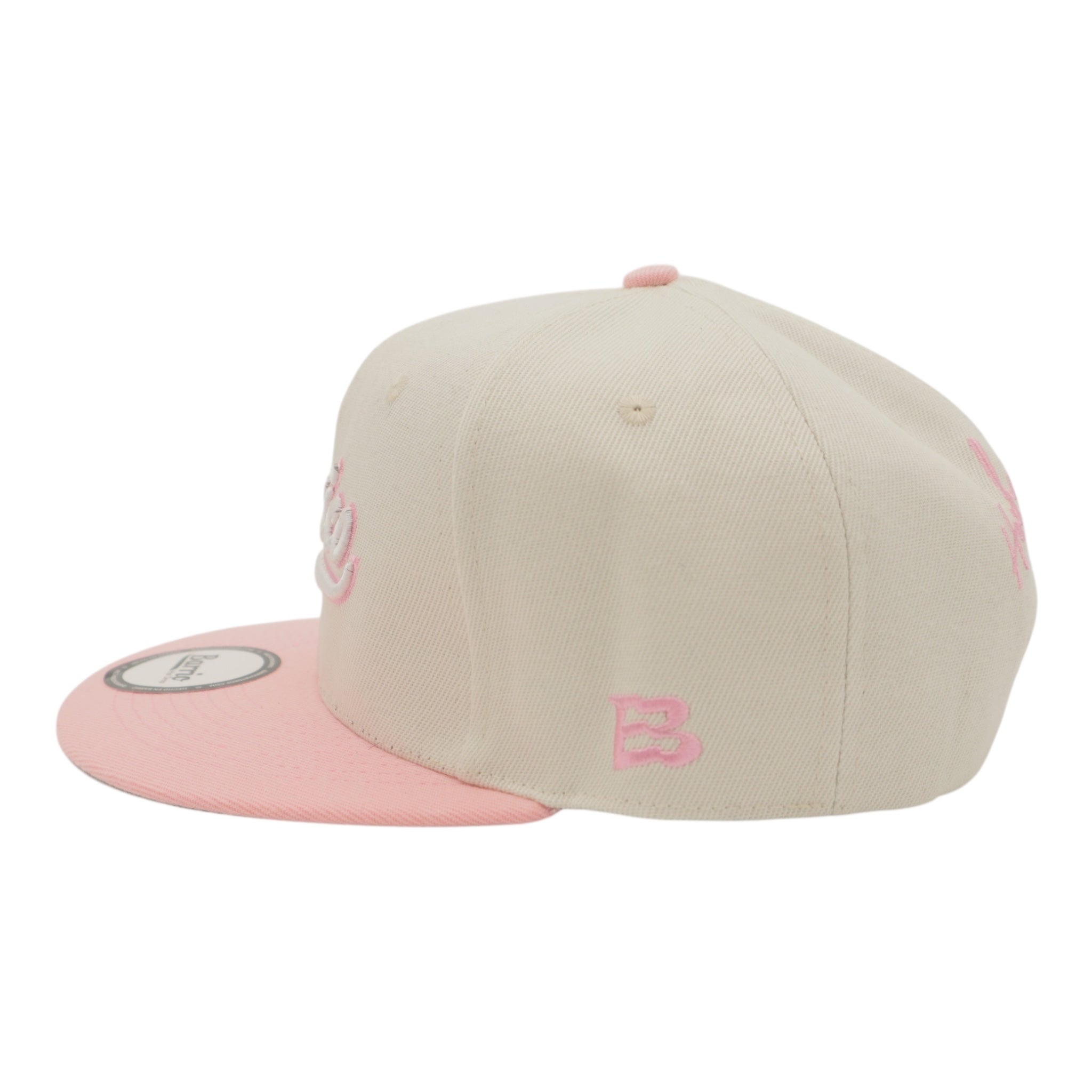 Two-tone beige and pink cap on a white background